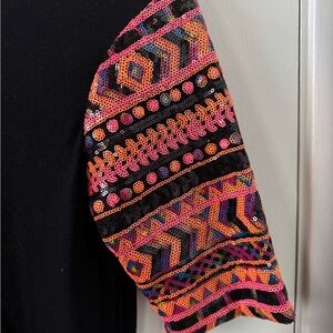 Black with sequined sleeves